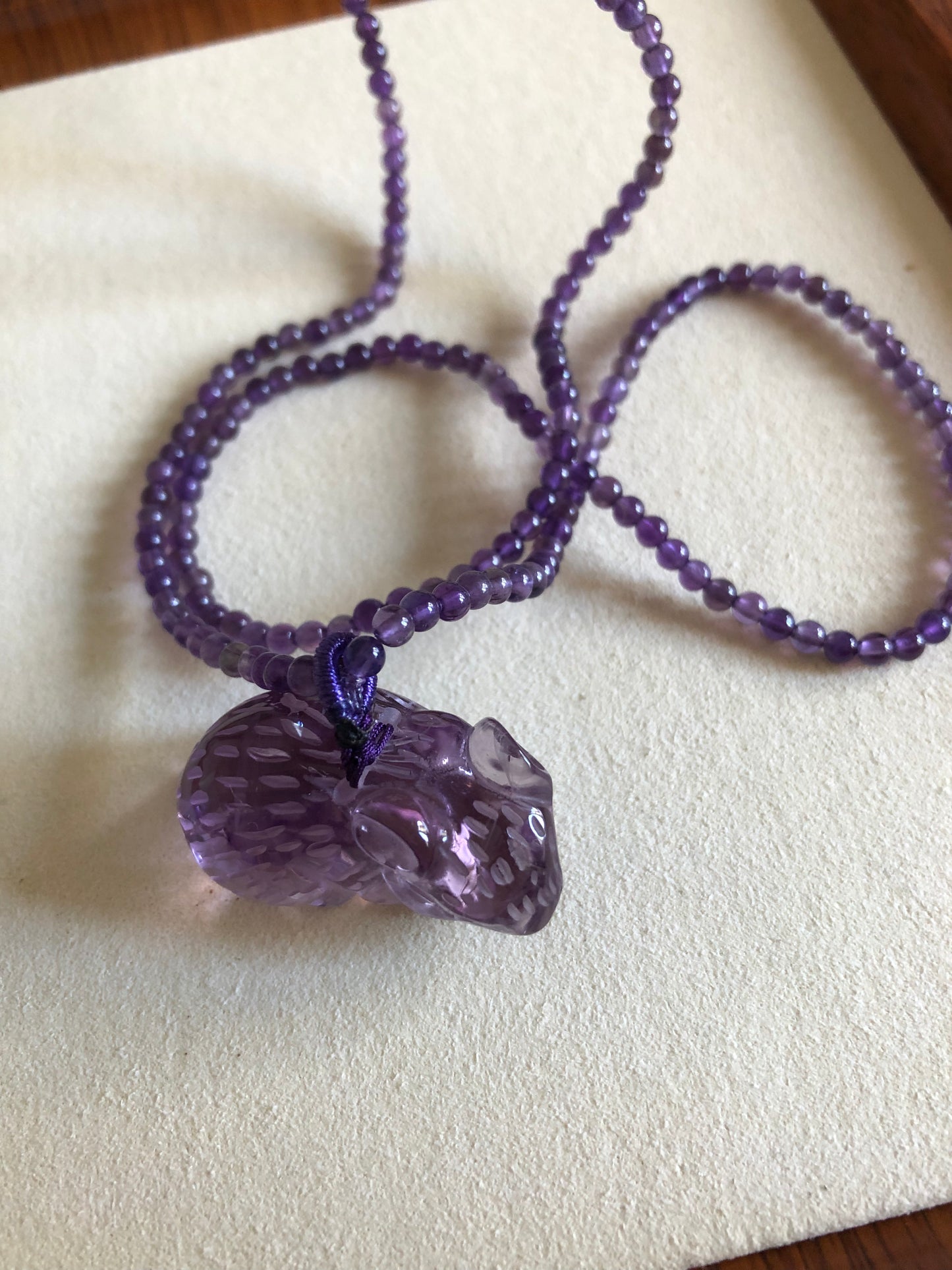 Natural hand caved amethyst mouse necklace